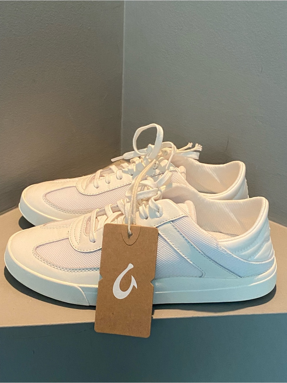 OluKai white leather sneakers